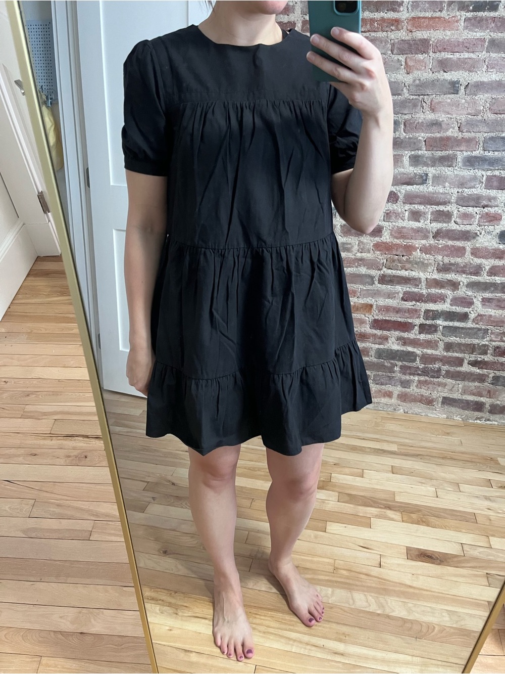 Black short-sleeve tiered mini swing dress from Pomander Place by Tuckernuck